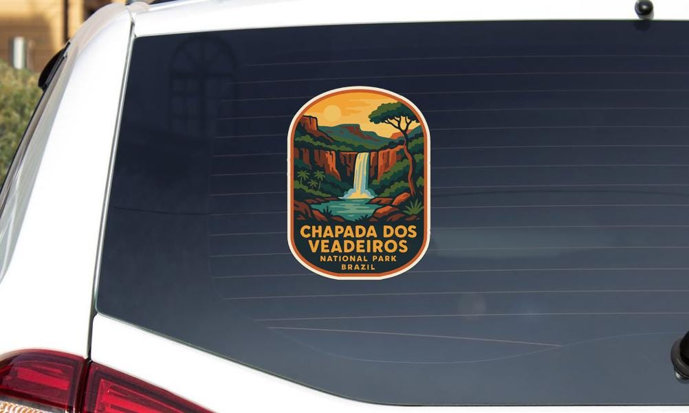a sticker on the rear window of a car that says "CHAPADA DOS VÉDEIROS NATIONAL PORTUGAL BRASIL".
