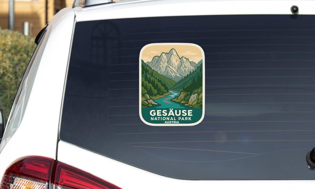 A sticker on the rear window of a car that says "Gesäuse National Park Austria".