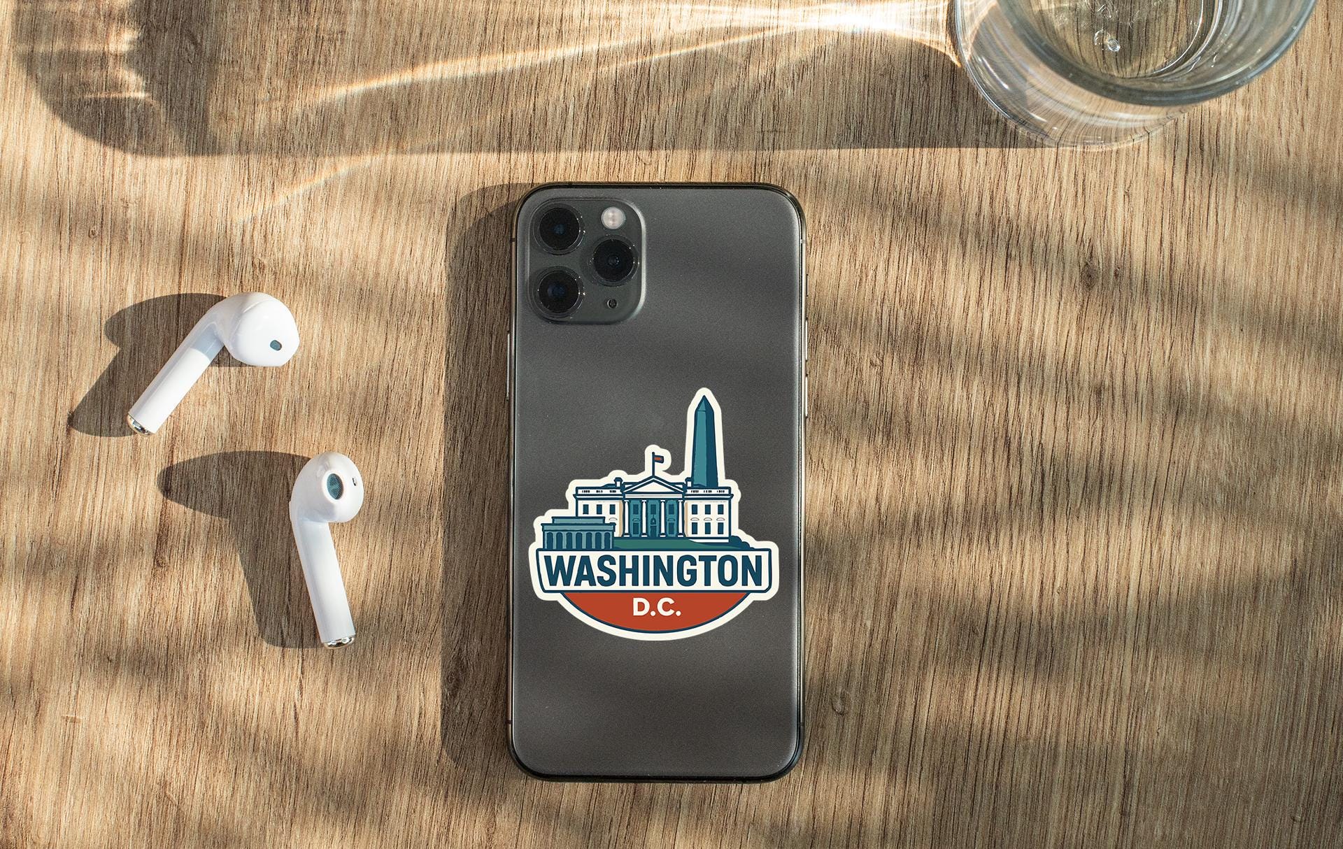 a cell phone sitting on top of a wooden table