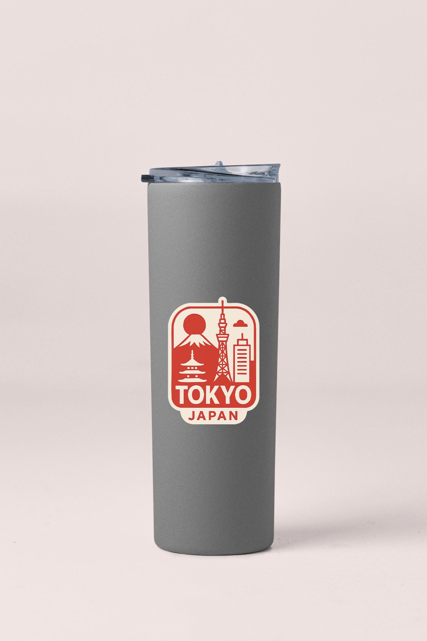 a travel mug with a picture of tokyo on it