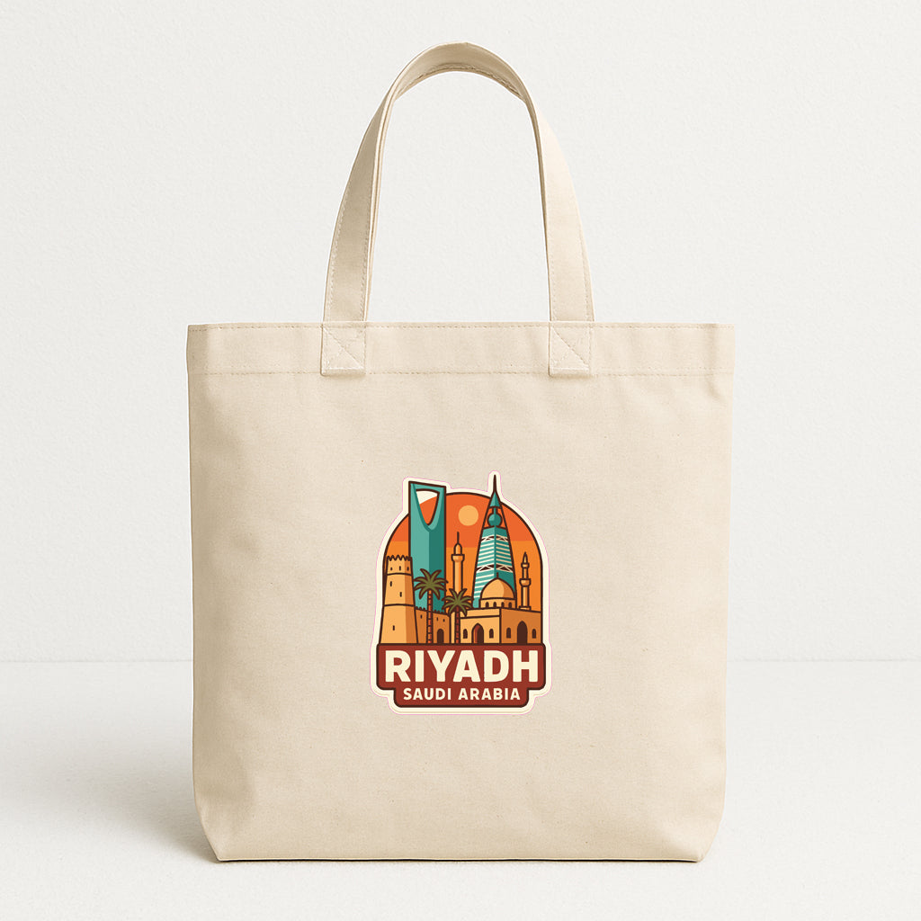 A beige tote bag with a graphic design featuring the skyline of Riyadh, Saudi Arabia.