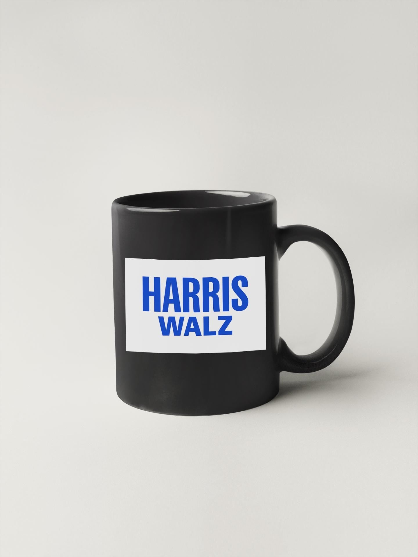 a black coffee mug with the words harris walz on it