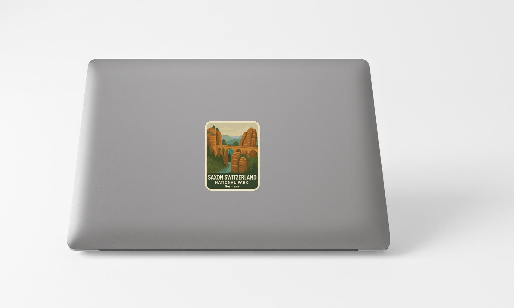 A sticker depicting the scenic landscape of the Swiss Alps, specifically the Sabon Swissland National Park.