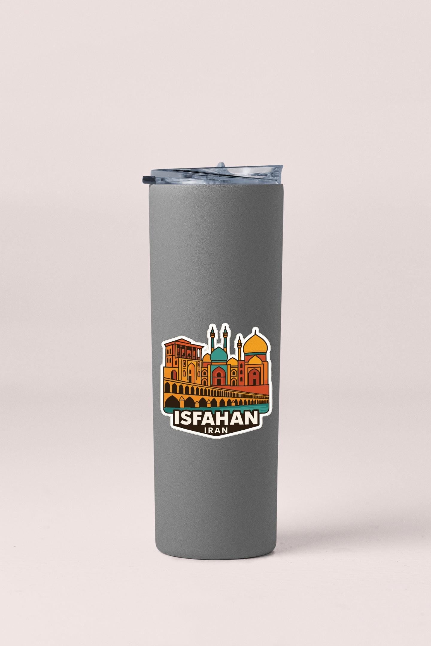 A gray insulated tumbler with a sticker depicting the skyline of Isfahan, Iran.