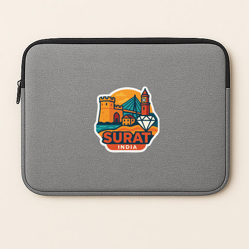 A gray laptop sleeve with a sticker depicting a cityscape and the text "SURAT INDIA".