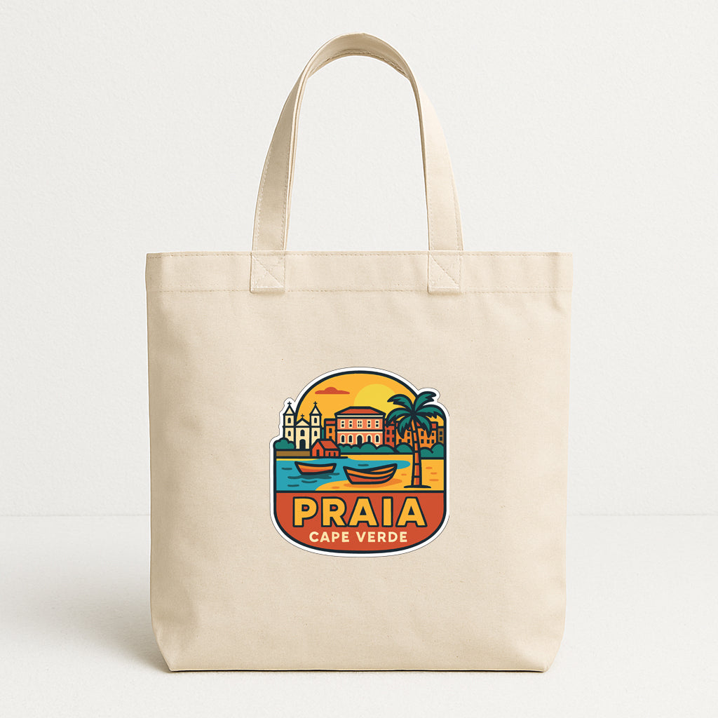 A beige tote bag with a colorful graphic design depicting a tropical cityscape and the text "PRAIA CAPE VERDE".