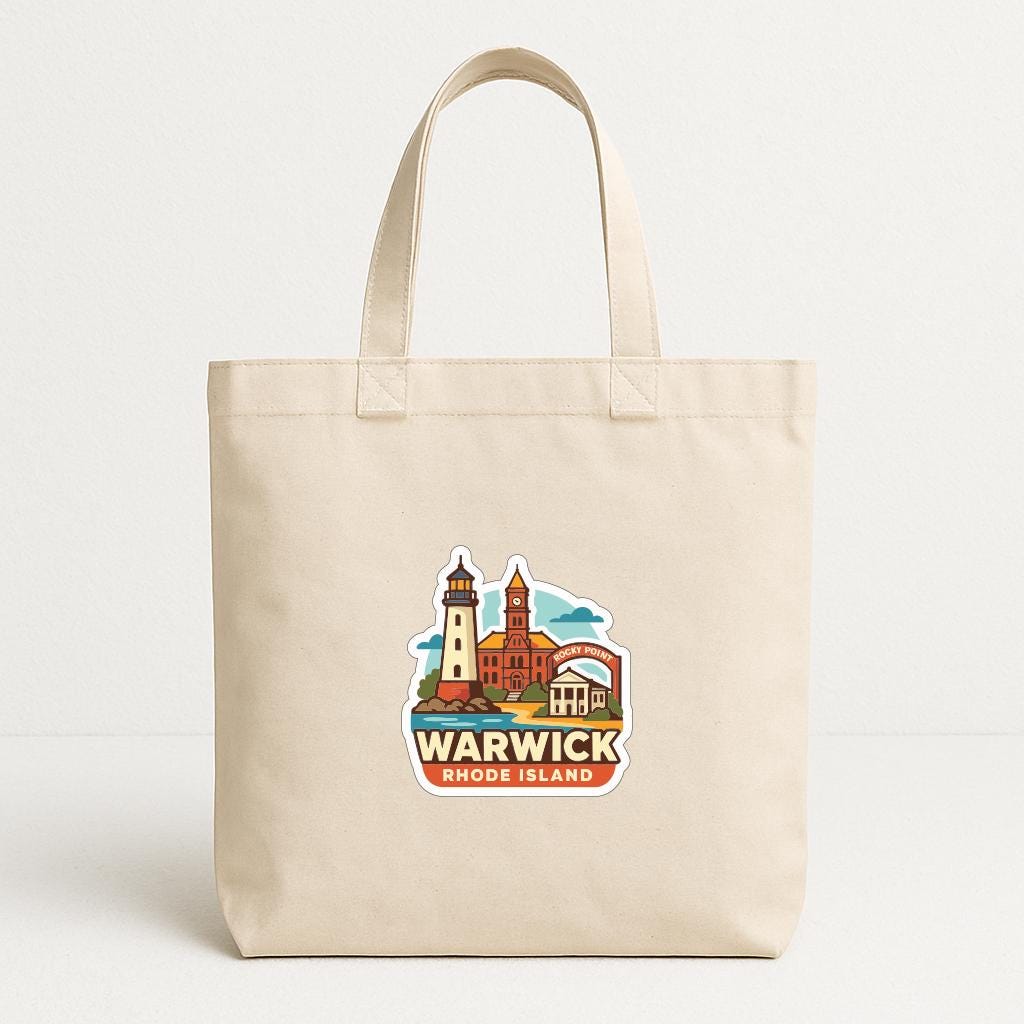 A beige tote bag with a printed design depicting a lighthouse and buildings, along with the text "WARWICK RHODE ISLAND".