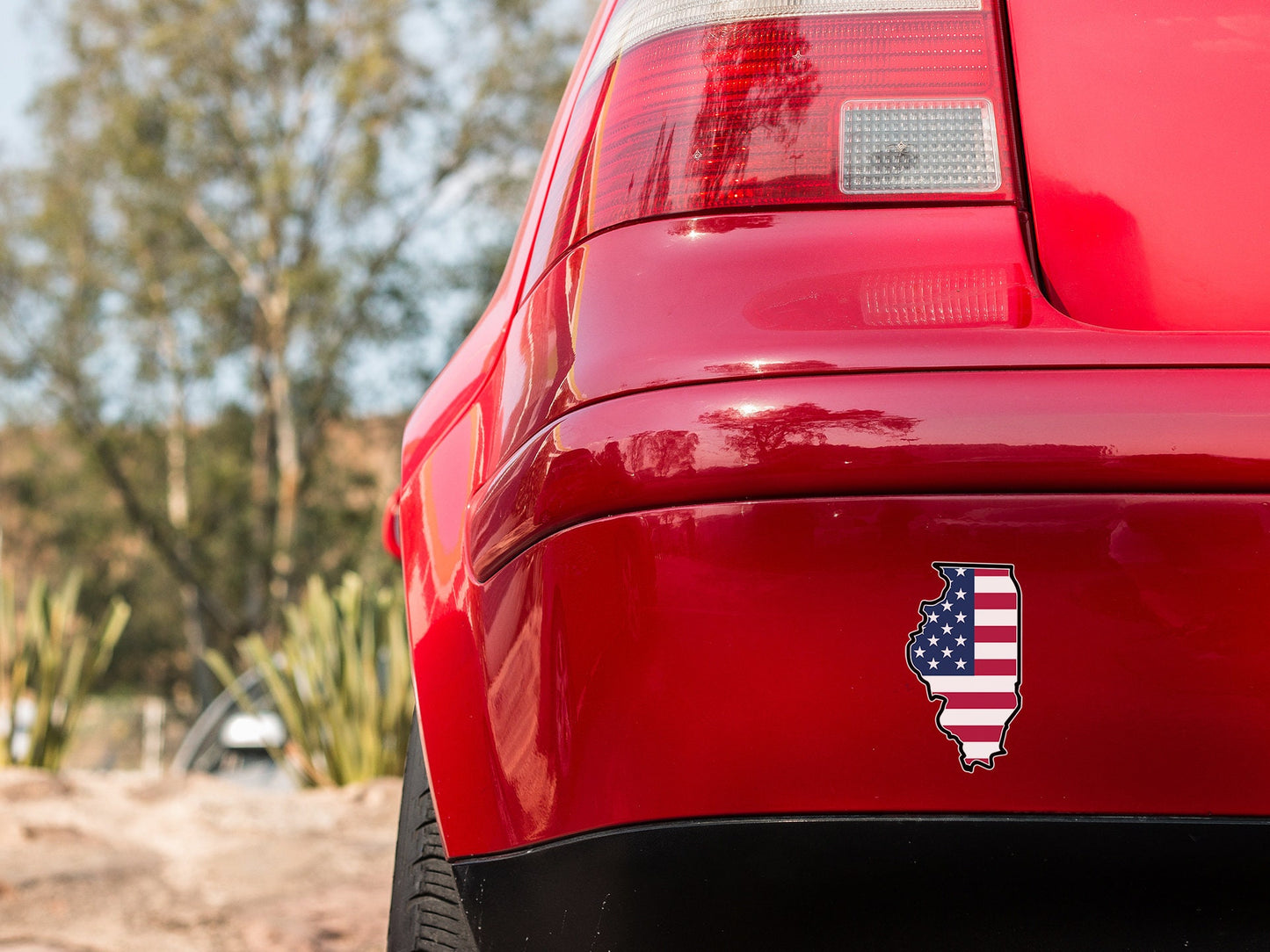 a red car with an american flag sticker on it