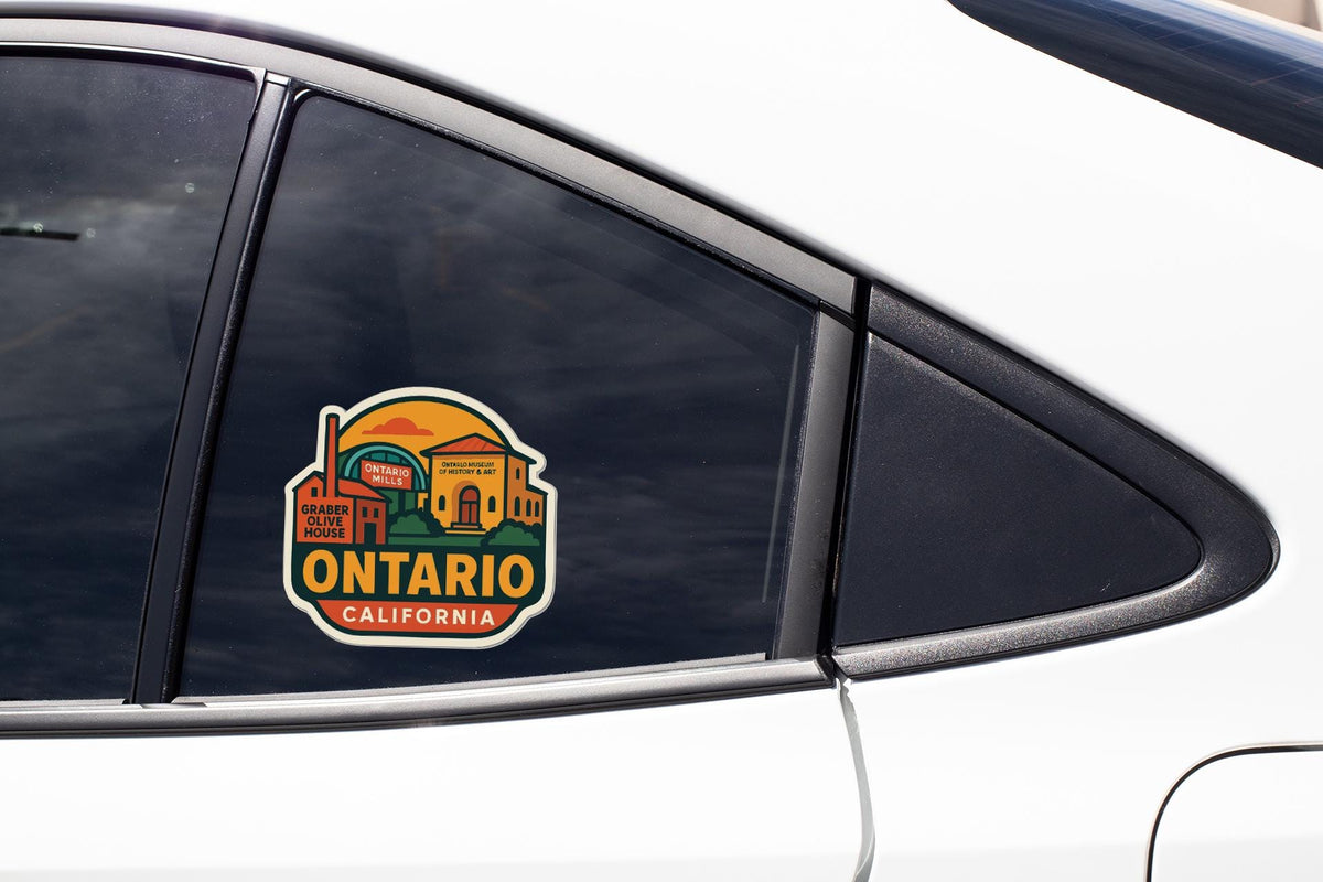 A sticker on the side of a car window, depicting a scenic view of Ontario, California.