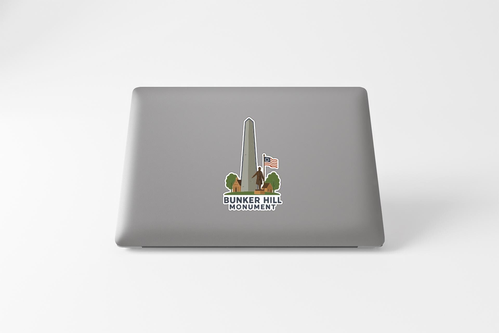 a sticker with a graphic of the Bunker Hill Monument, which is a significant historical landmark in the United States.
