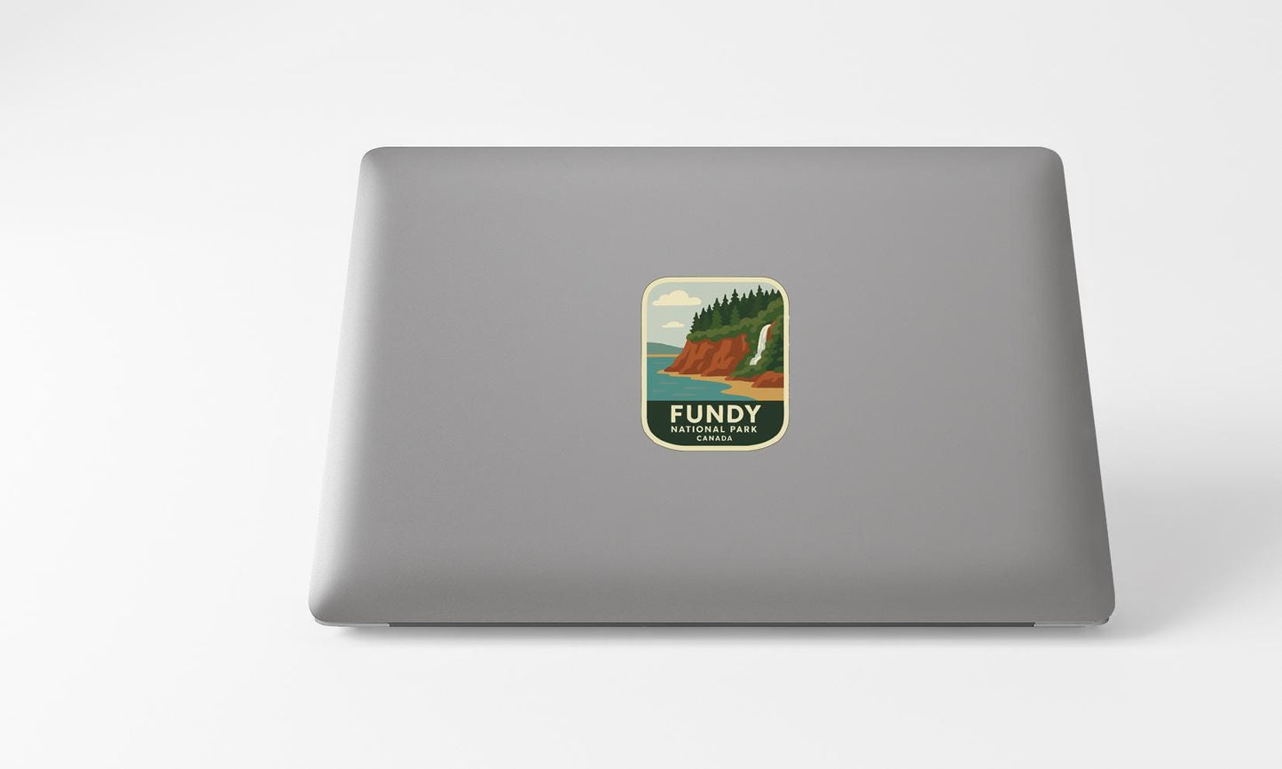 a sticker with a scenic landscape on a laptop.