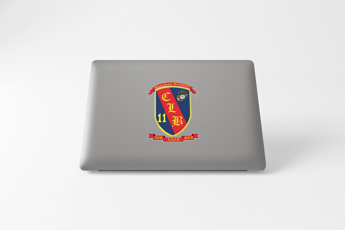 a laptop with a picture of a shield on it