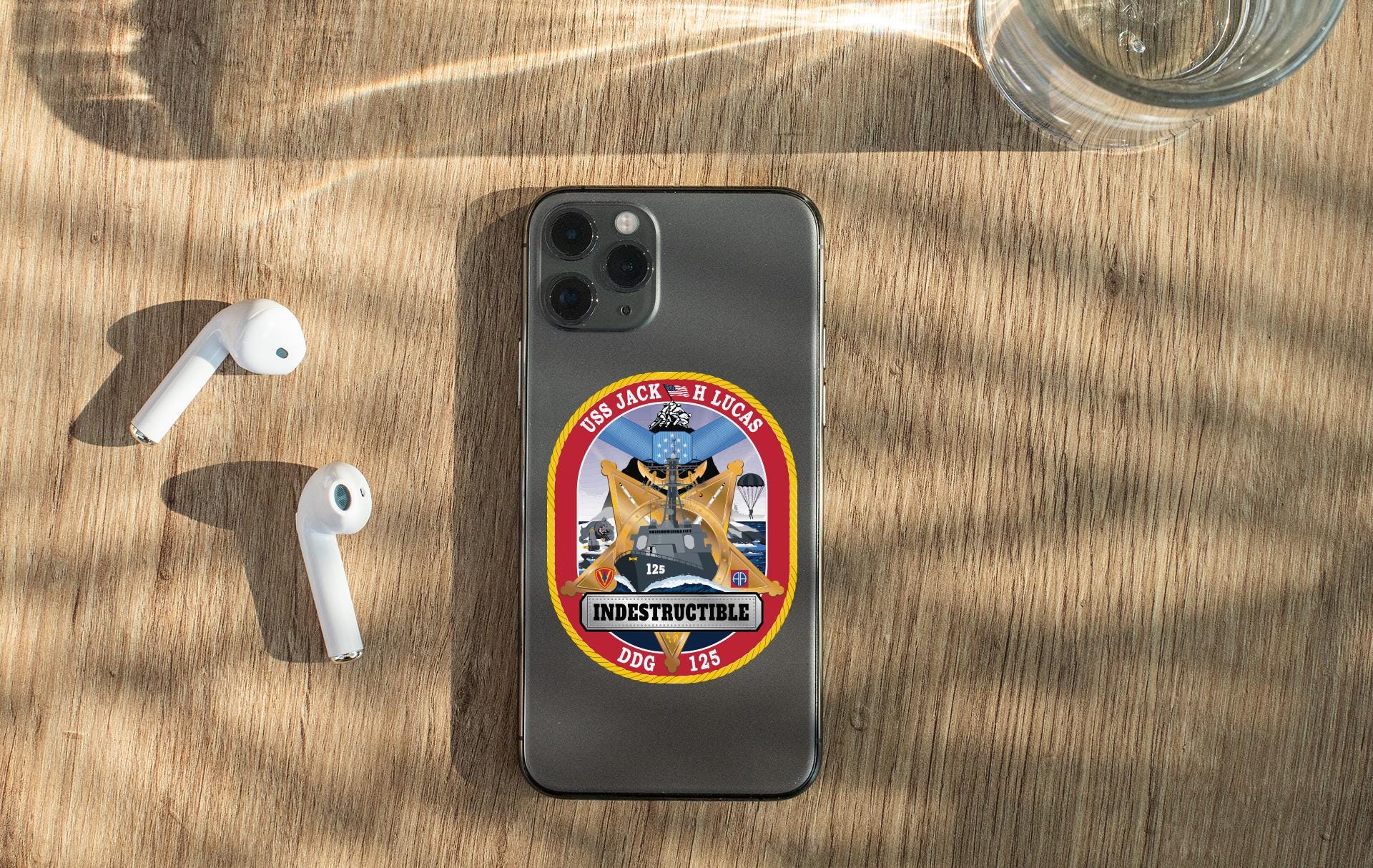 a cell phone sitting on top of a wooden table