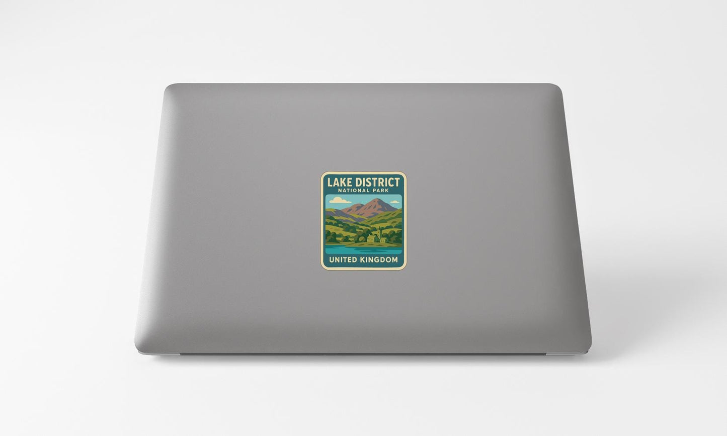 a sticker on the back of a laptop that says "LAKED DISTRICT UNITED KINGDOM".