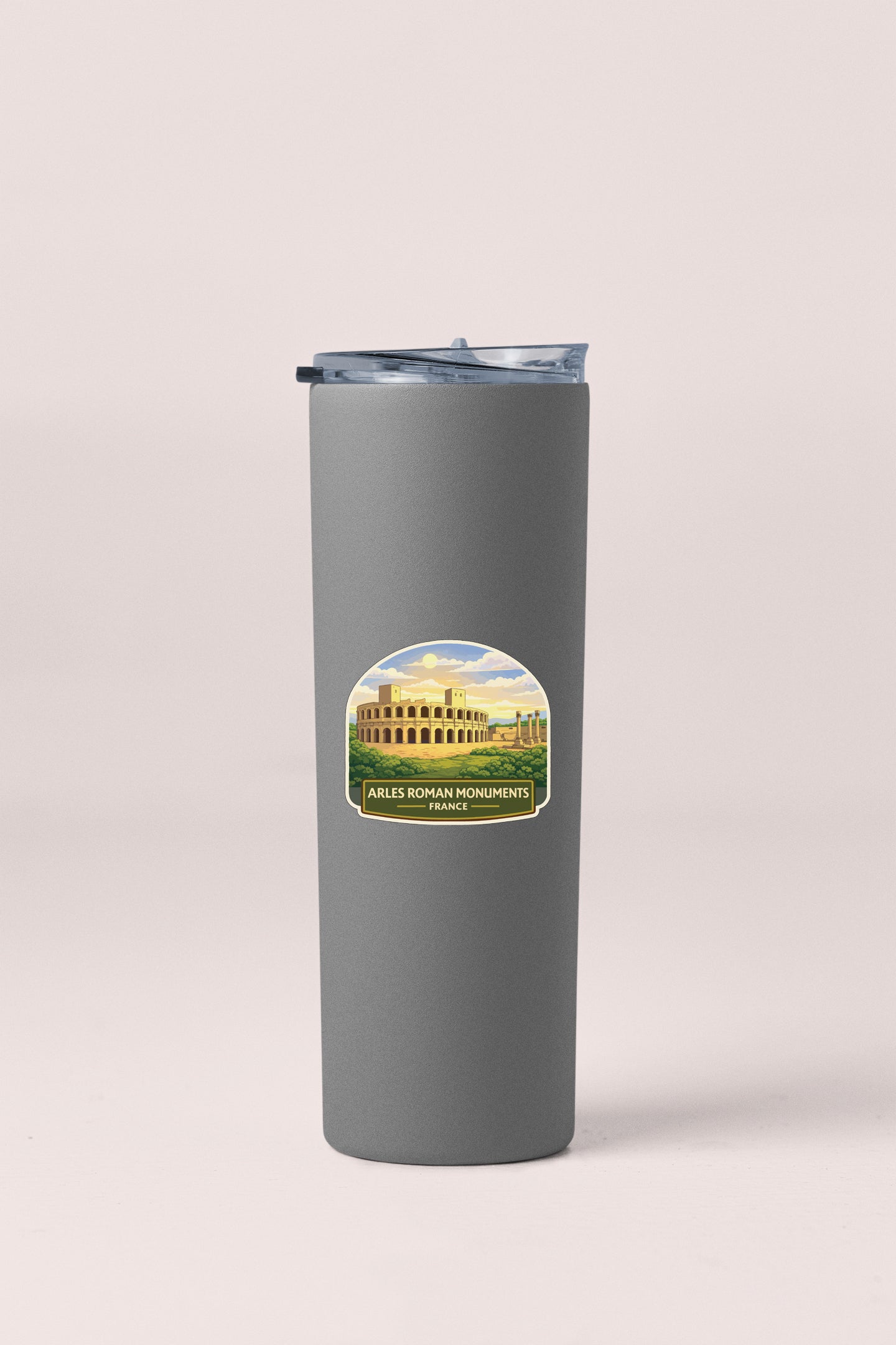 A gray insulated tumbler with a label featuring an illustration of the Colosseum in Rome, Italy.