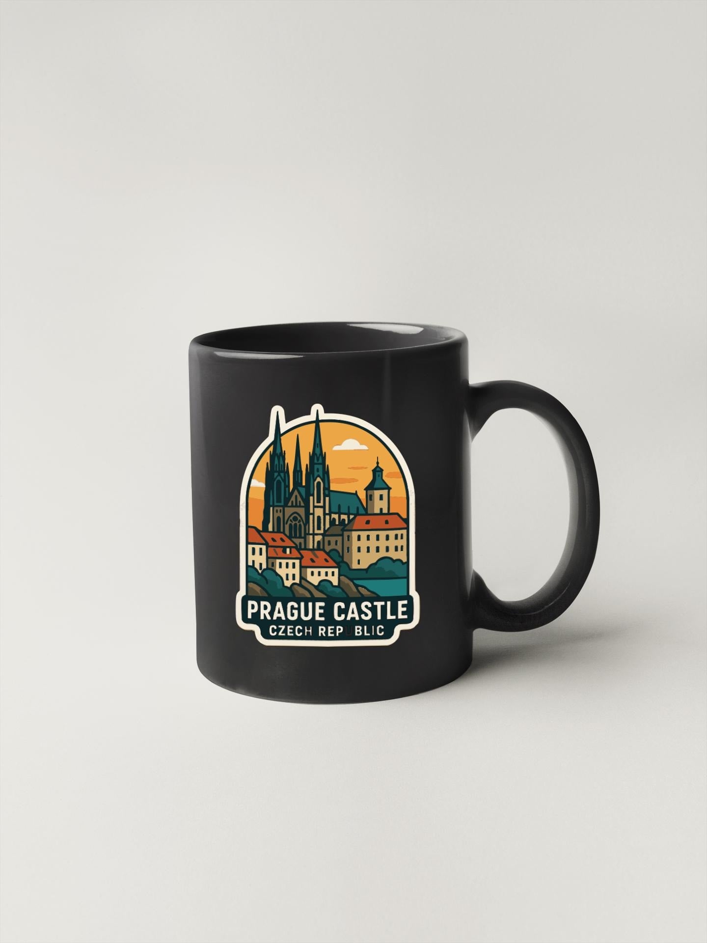 A black coffee mug with a graphic design depicting the Prague Castle in the Czech Republic.