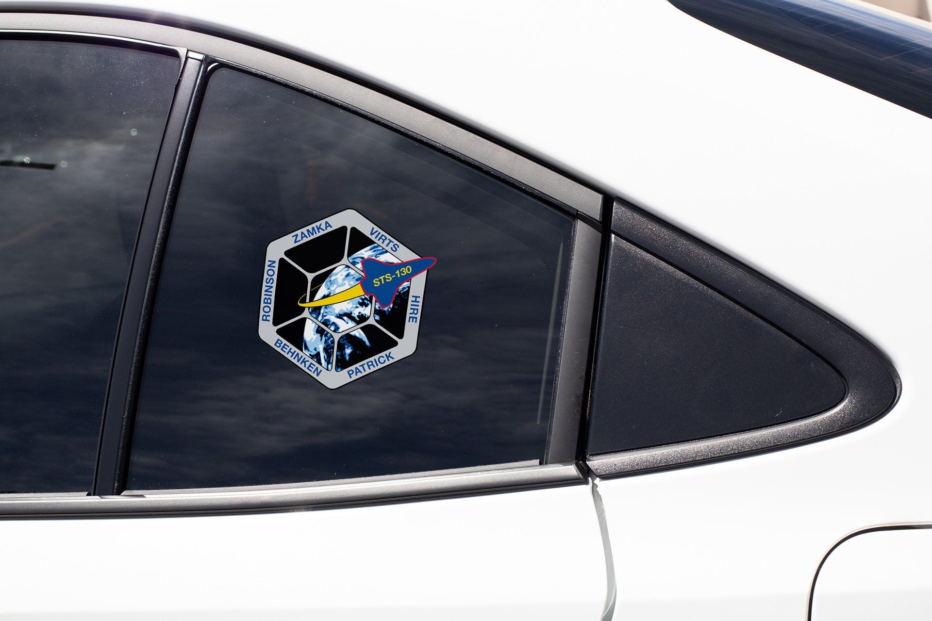 a sticker on the side of a white car