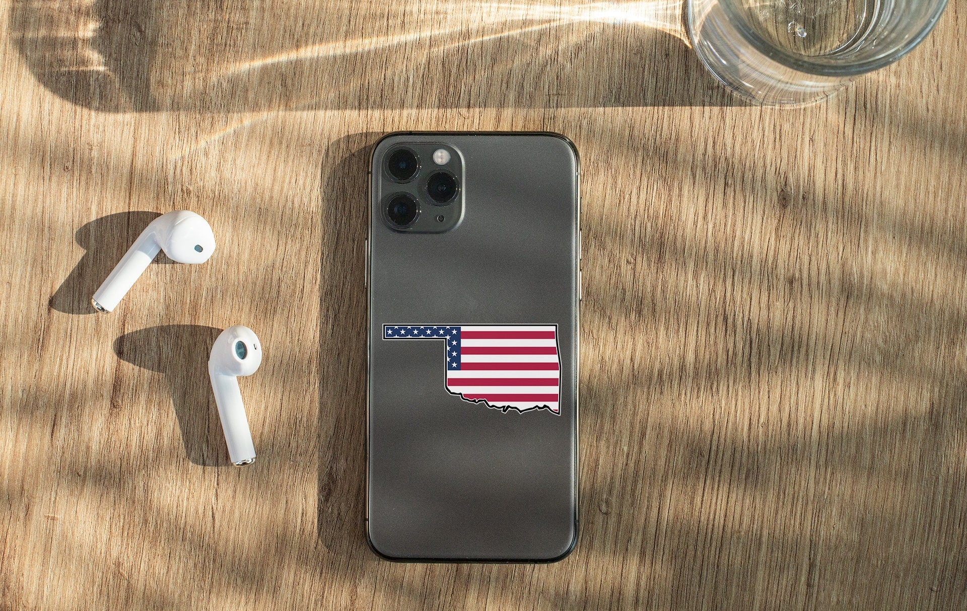 a cell phone with a sticker of the state of indiana
