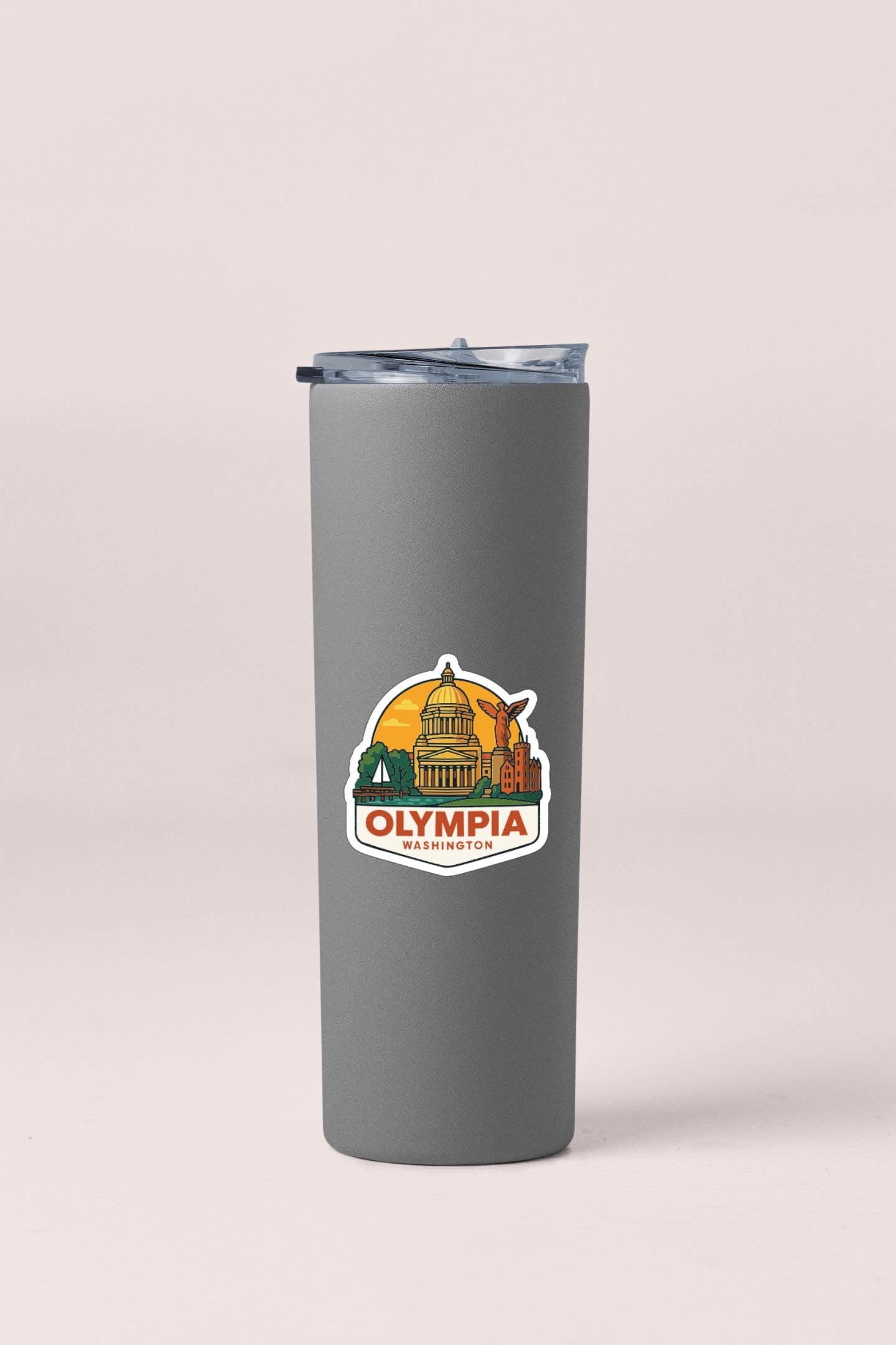 A gray insulated tumbler with a sticker depicting the city of Olympia, Washington.