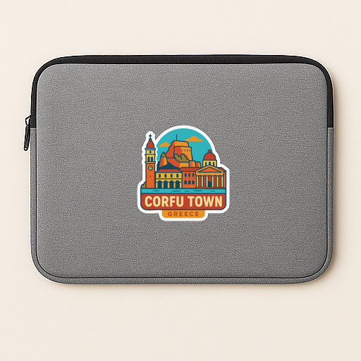 A gray laptop sleeve with a colorful sticker depicting the town of Corfu, Greece.