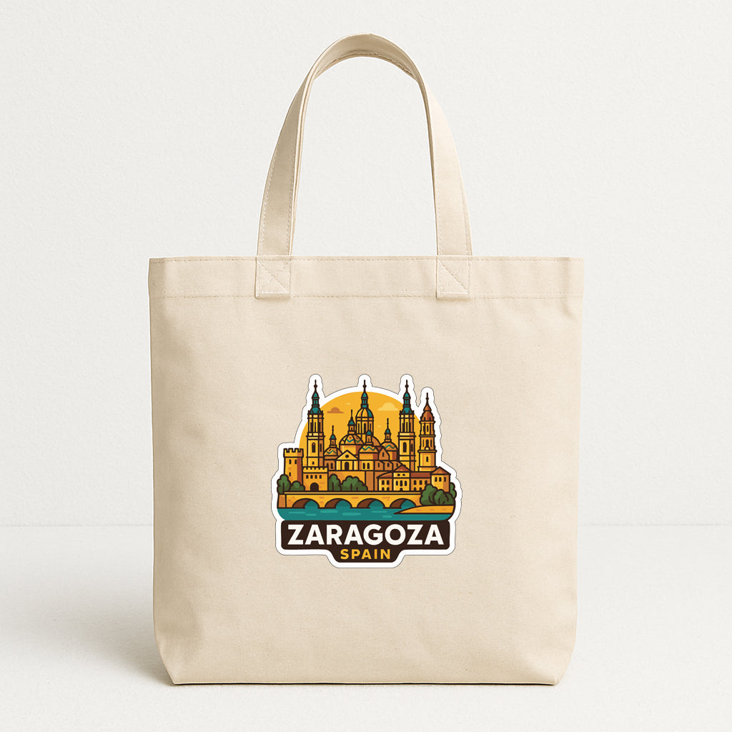 A beige tote bag with a printed design of the Zaragoza cityscape in Spain.