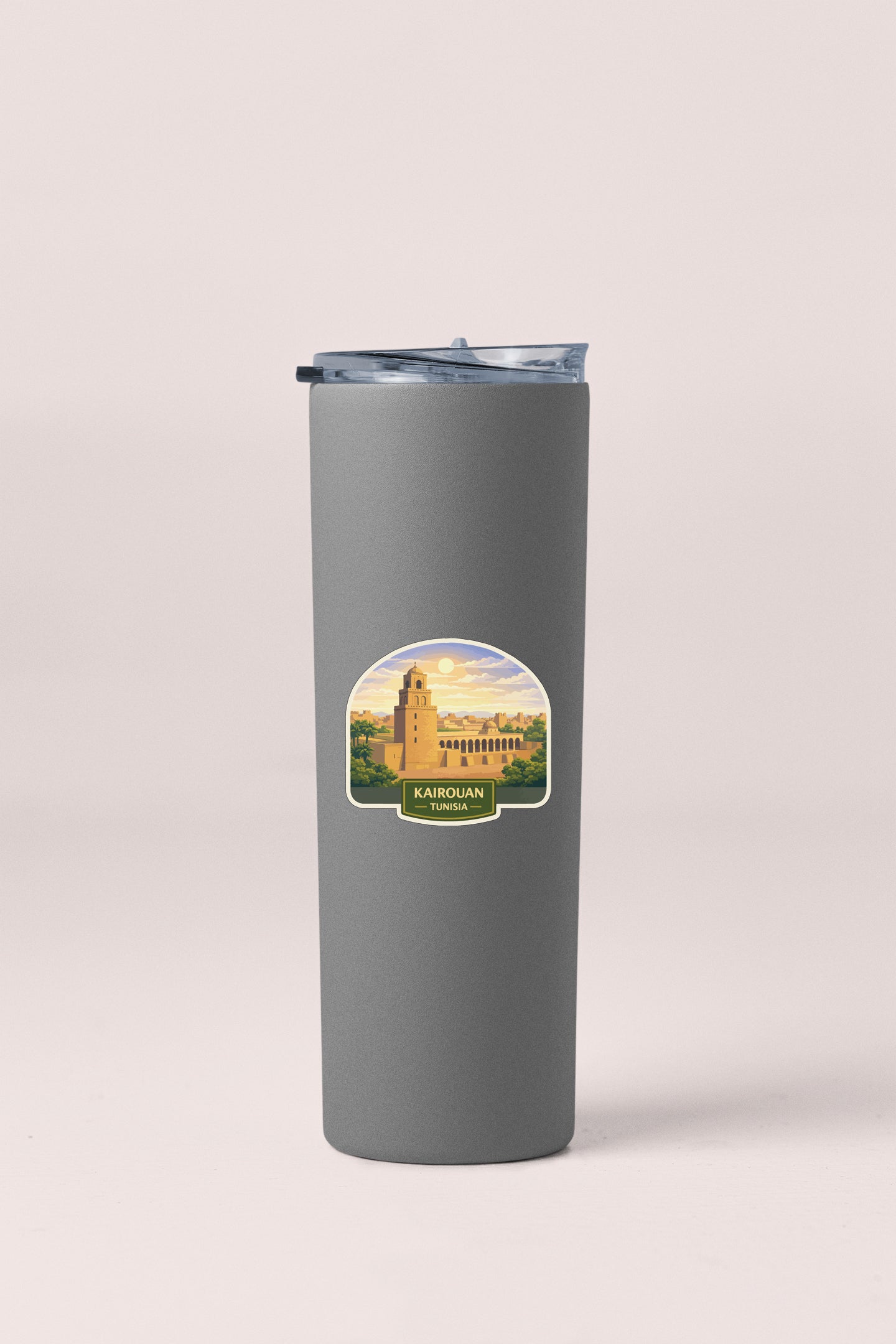 A gray insulated tumbler with a sticker depicting a building and landscape.