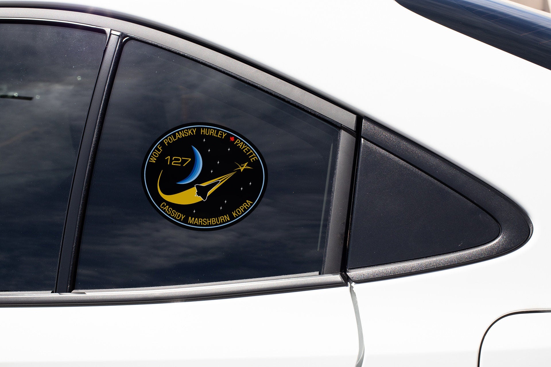 a close up of a car window with a sticker on it