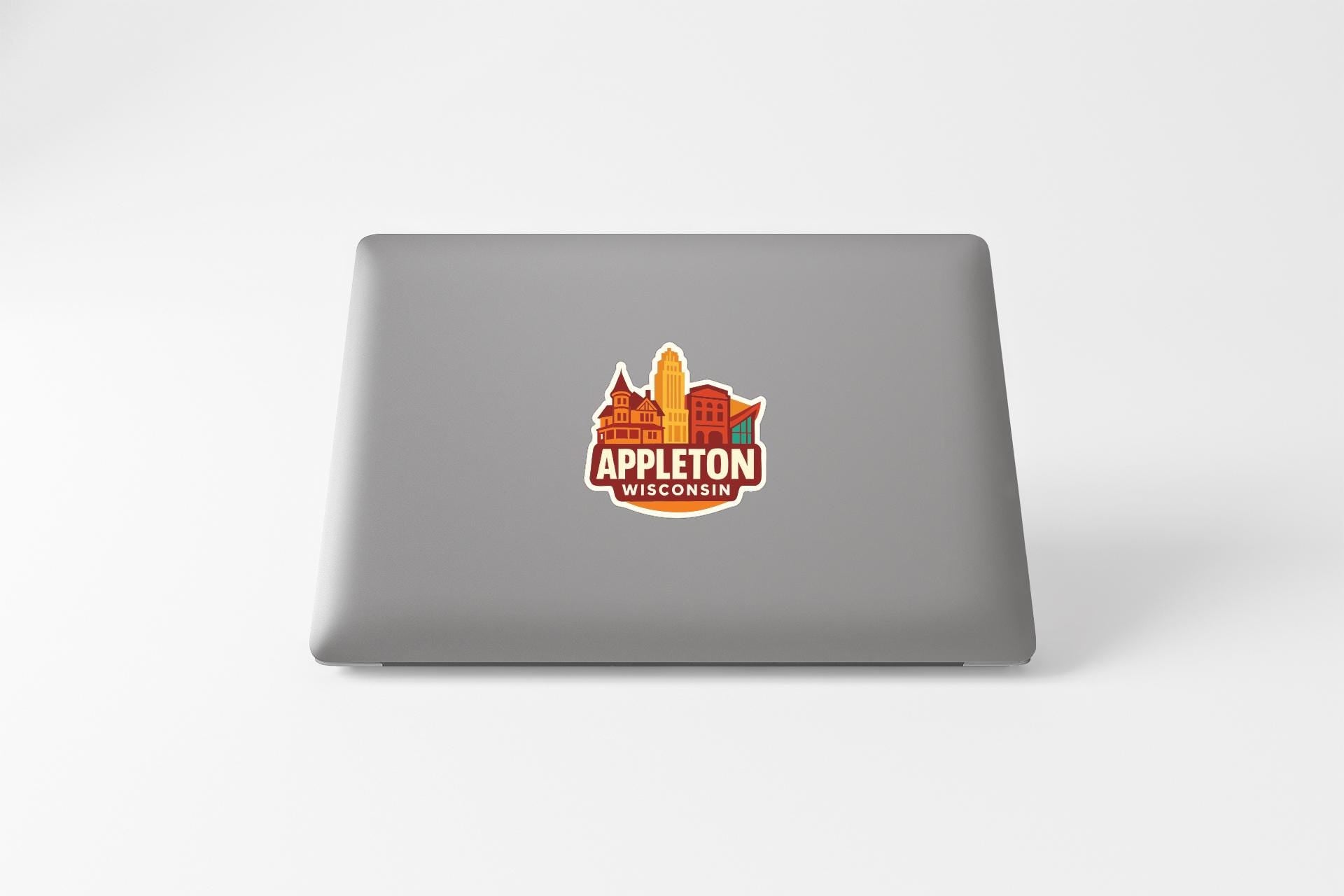 a sticker with the text "APPLETON WISCONSIN" on the back of a laptop.