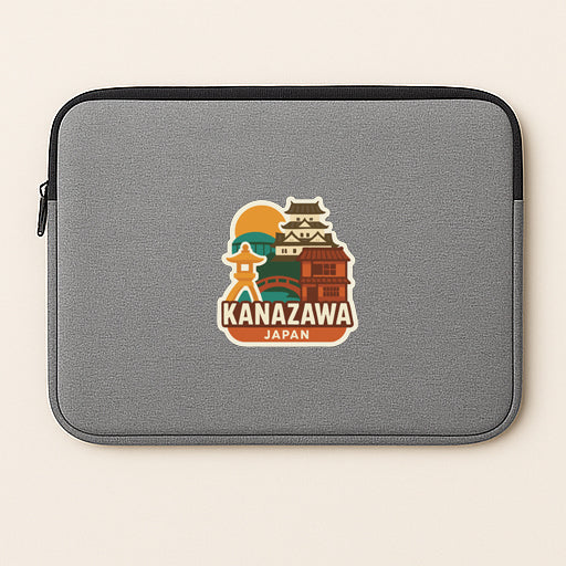 A gray laptop sleeve with a sticker depicting a landmark in Japan.