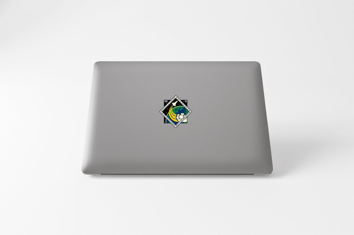 a laptop with a sticker of a cat on it