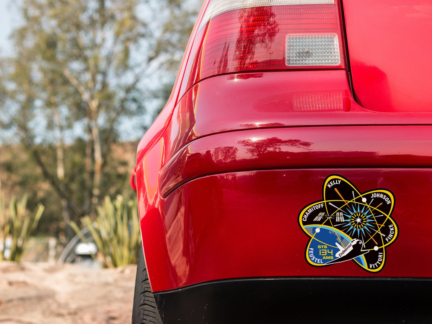 a close up of the rear end of a red car