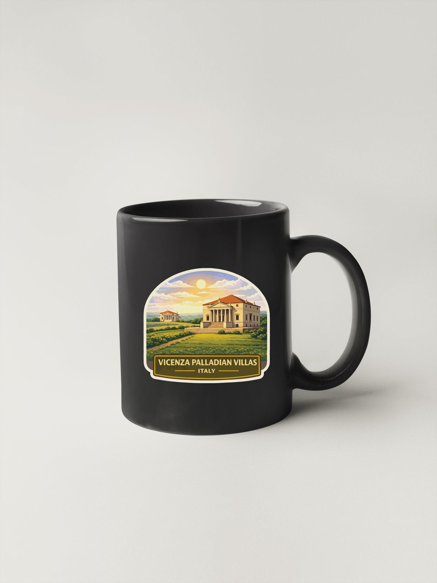 A black coffee mug with a label depicting a scenic view of Vicenza Palladian villas in Italy.