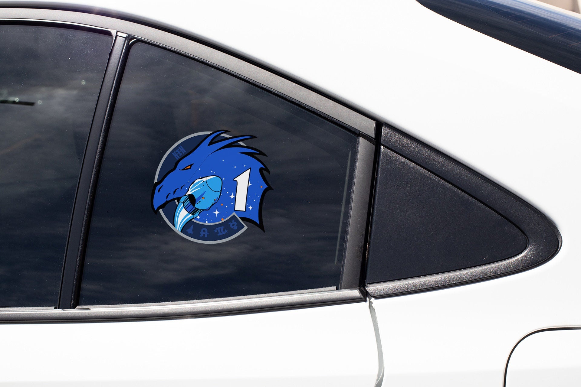 a close up of a car window with a sticker on it