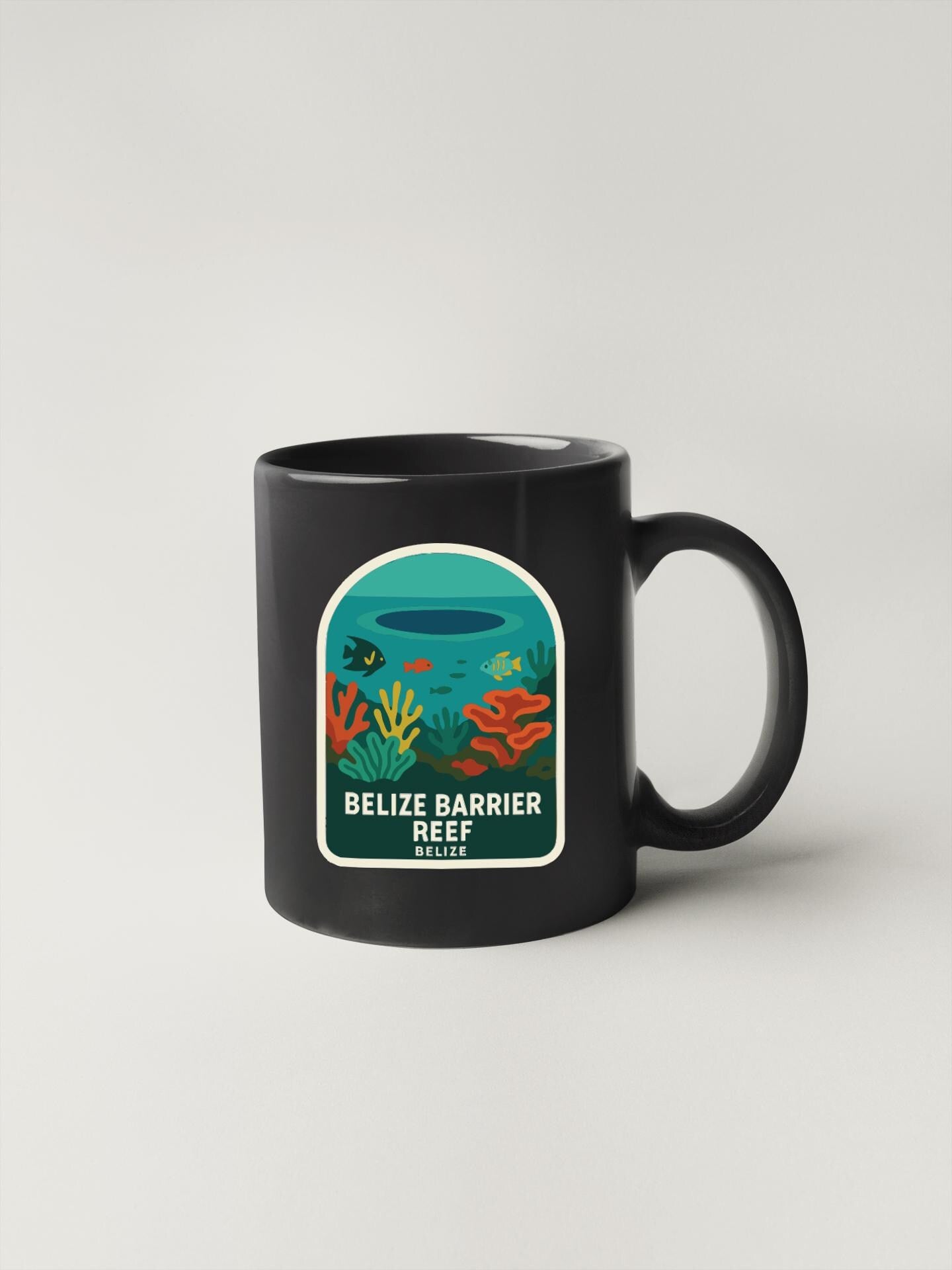 A black coffee mug with a colorful illustration of a coral reef and the text "Belize Barrier Reef Belize" printed on it.