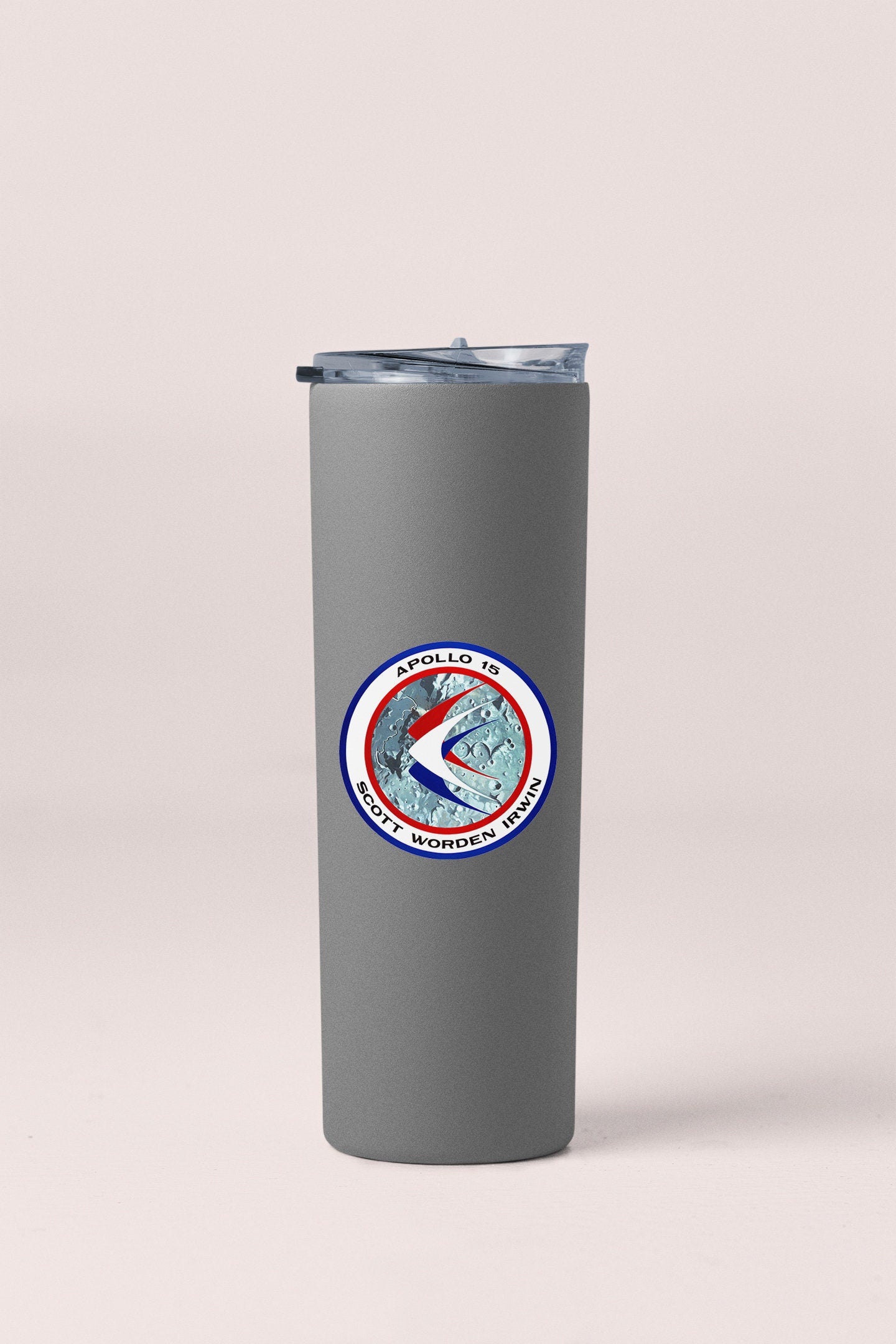 a gray tumbler cup with a red, white, and blue logo