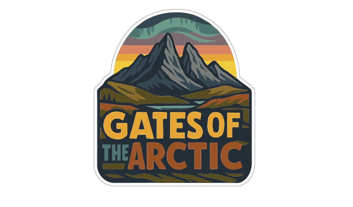 A colorful sticker or logo depicting a mountain landscape with a sunset in the background, featuring the text "GATES OF THE ARCTIC".