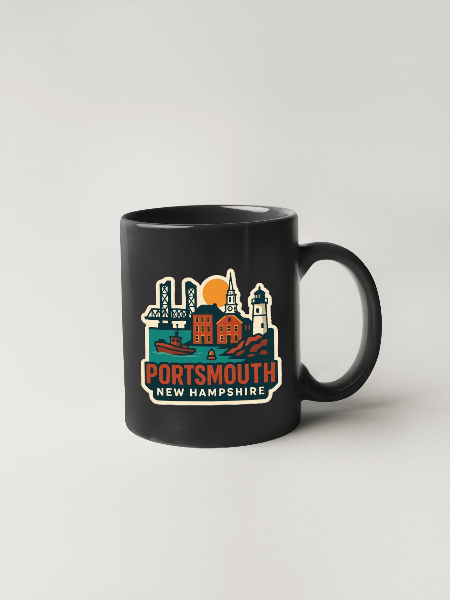 A black coffee mug with a graphic design depicting the cityscape of Portsmouth, New Hampshire.
