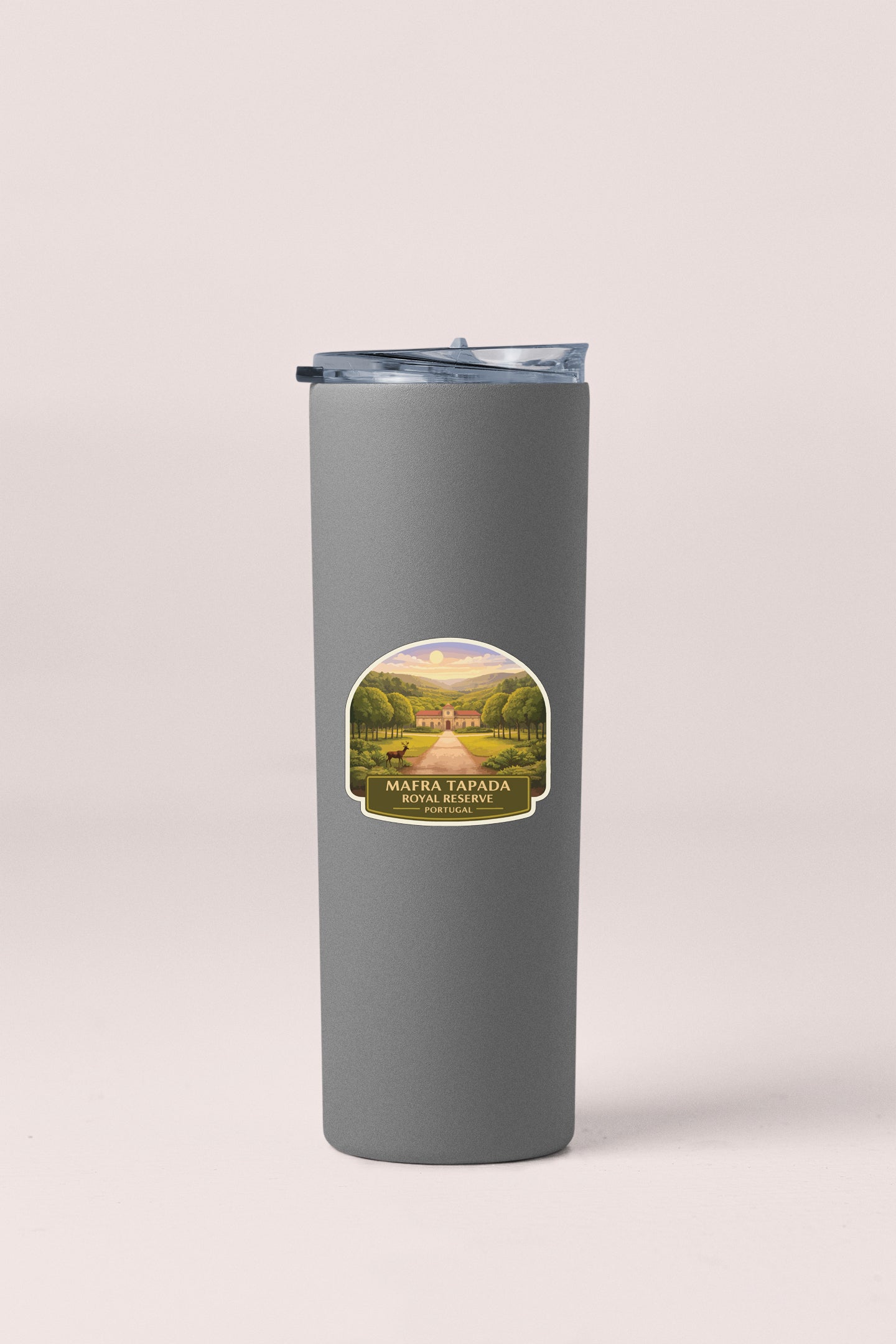 A gray cylindrical container with a label that features a scenic landscape.