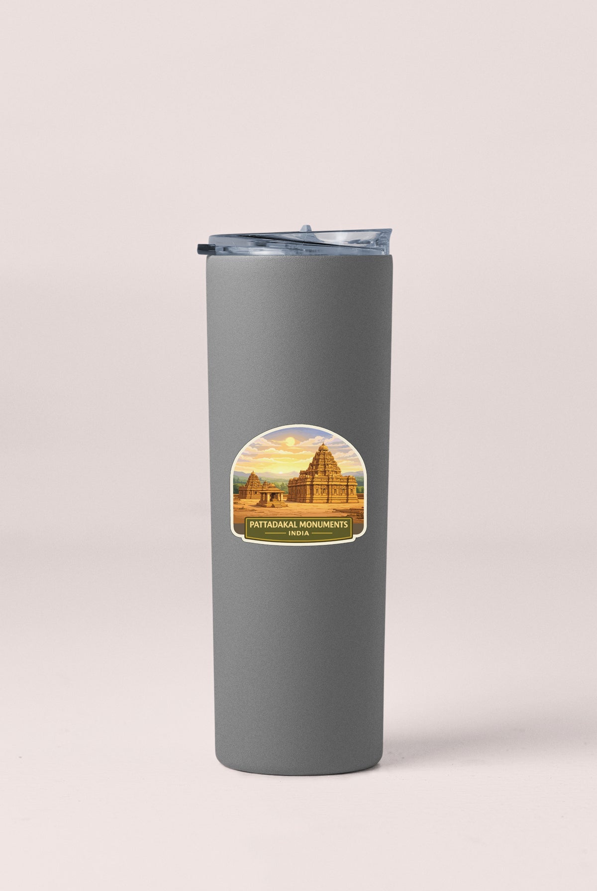 A gray tumbler with a sticker depicting a temple or monument.