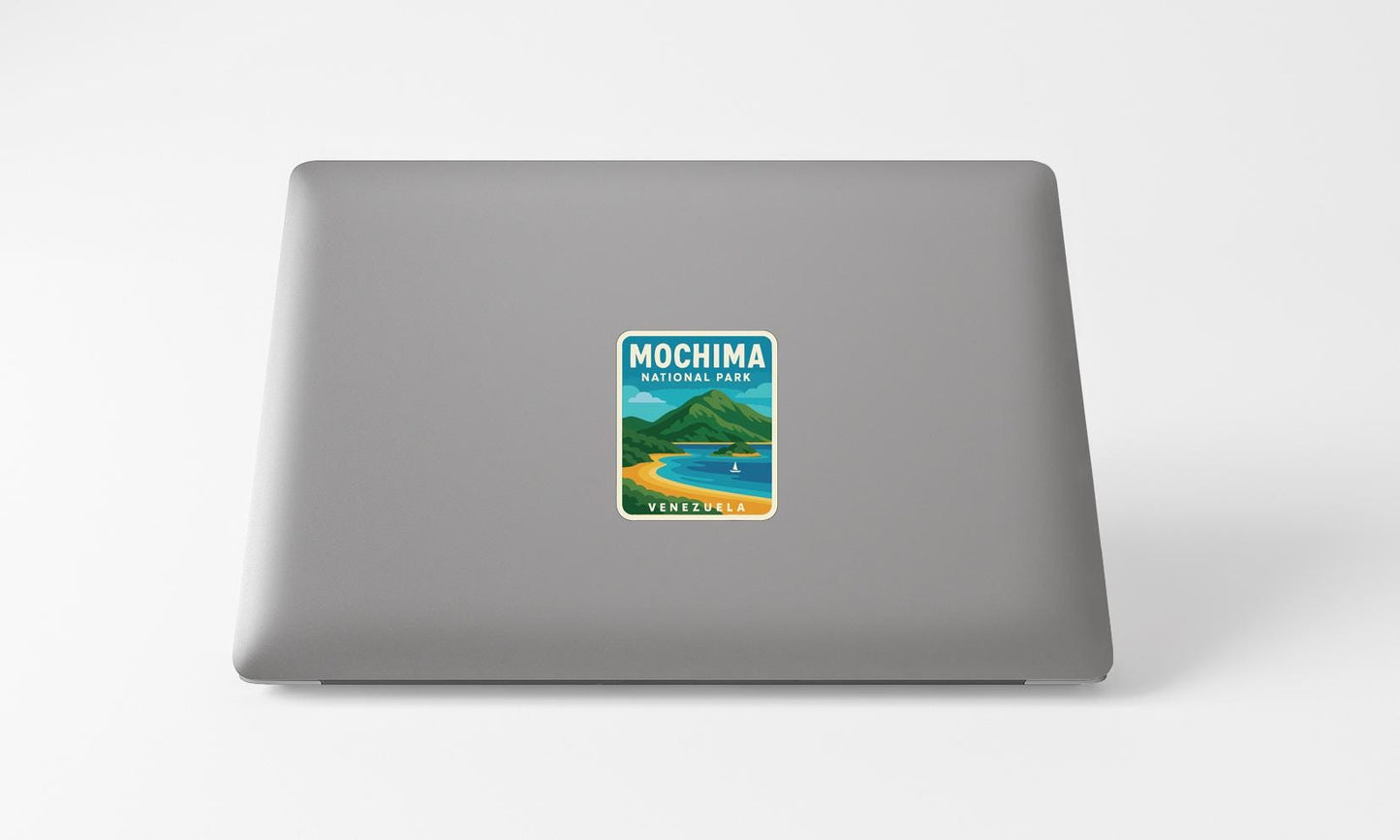 A sticker on the back of a laptop displaying the text "Mochima National Park VENEZUELA" along with an illustration of a beach and mountains.