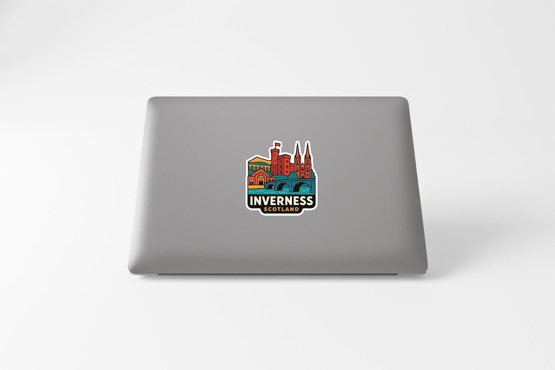 A sticker on the back of a laptop displaying the logo for Inverness, Scotland.