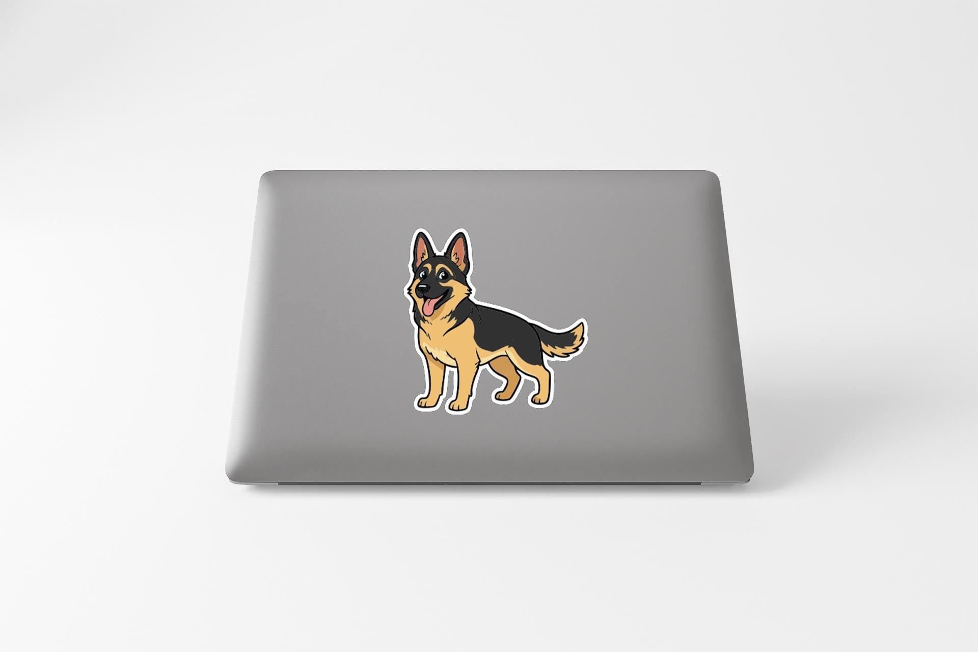 A sticker of a German Shepherd dog on the back of a laptop computer.