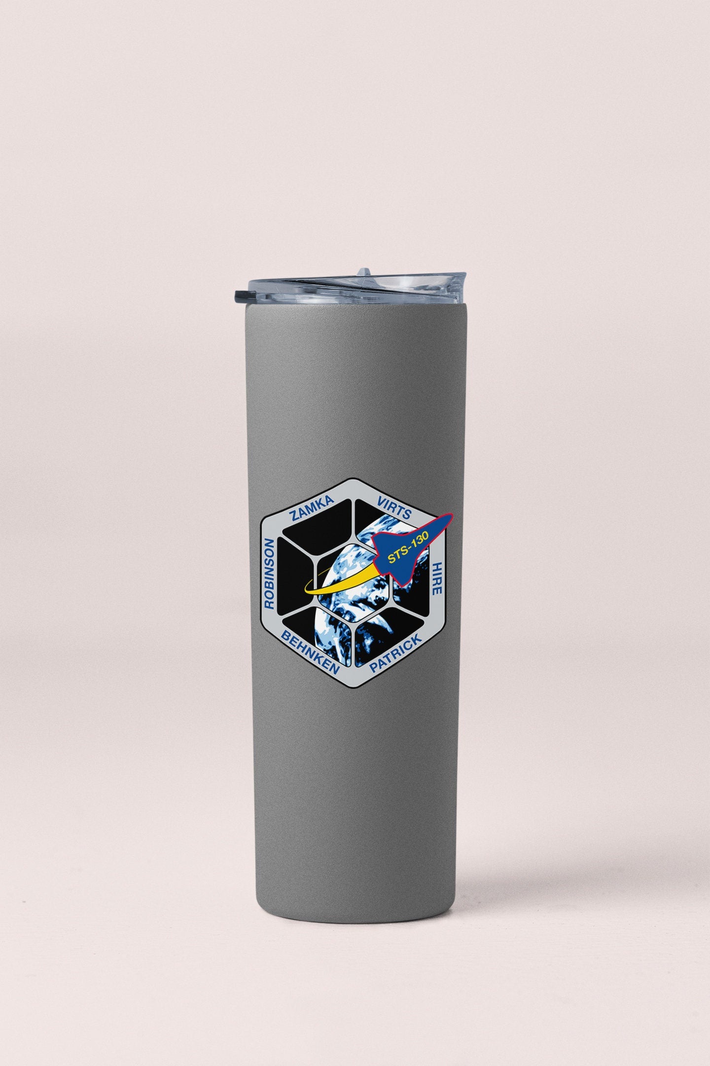 a stainless steel tumbler with a space shuttle on it