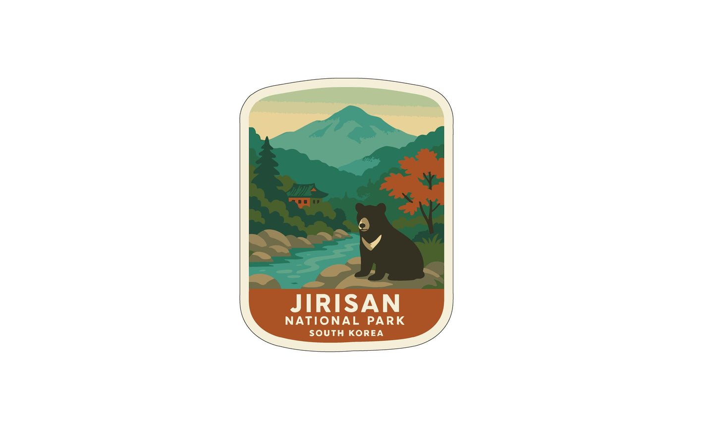 A sticker depicting a bear in a natural setting, with mountains and trees in the background.