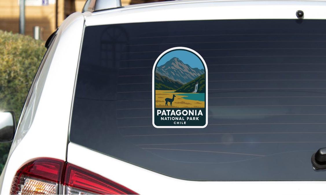 A sticker on the rear window of a car that says "Patagonia NATIONAL PARK CHILE".