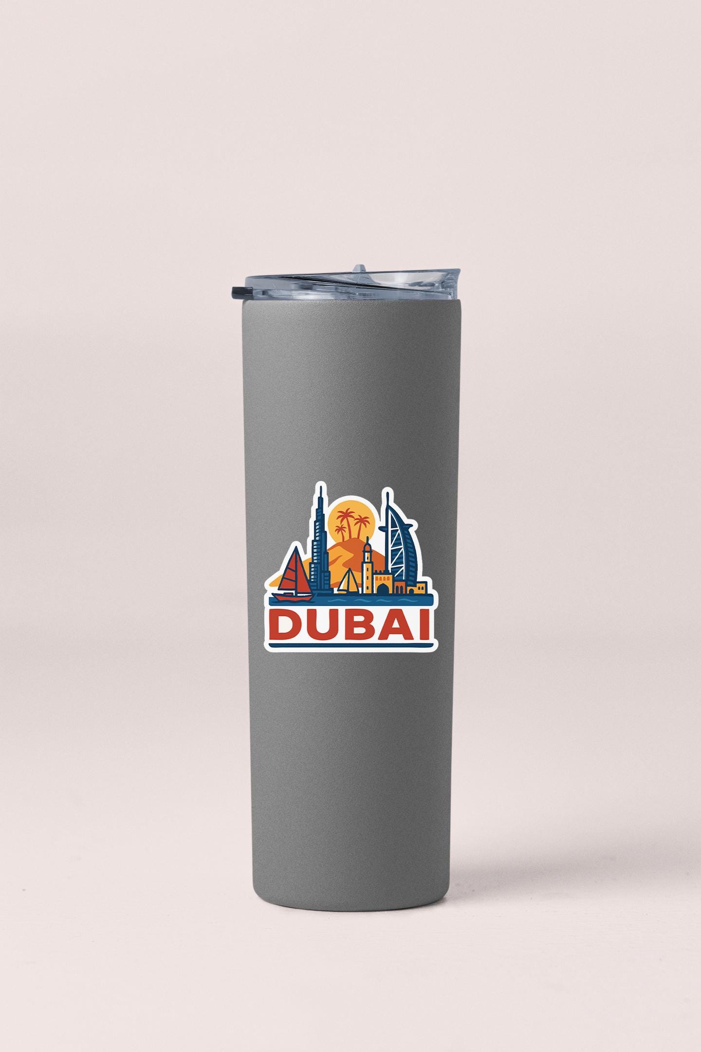 a travel mug with a picture of the city of dubai