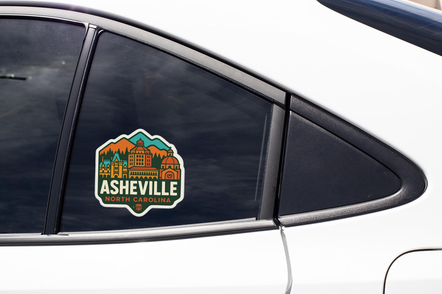 A sticker on the side of a car window that says "Asheville, North Carolina".