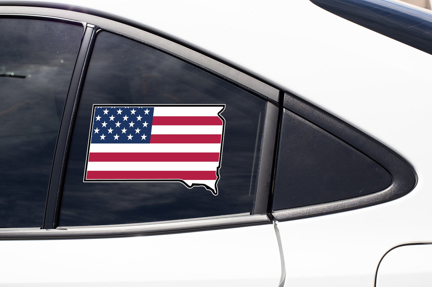 an american flag sticker on a car window
