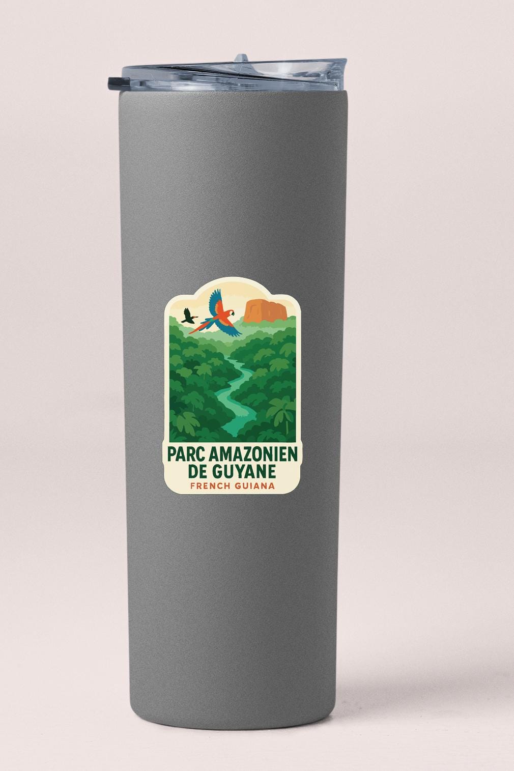 A gray cylindrical container with a label that says "PARC AMAZONIEN DE GUYANE FRENCH GUYANA".