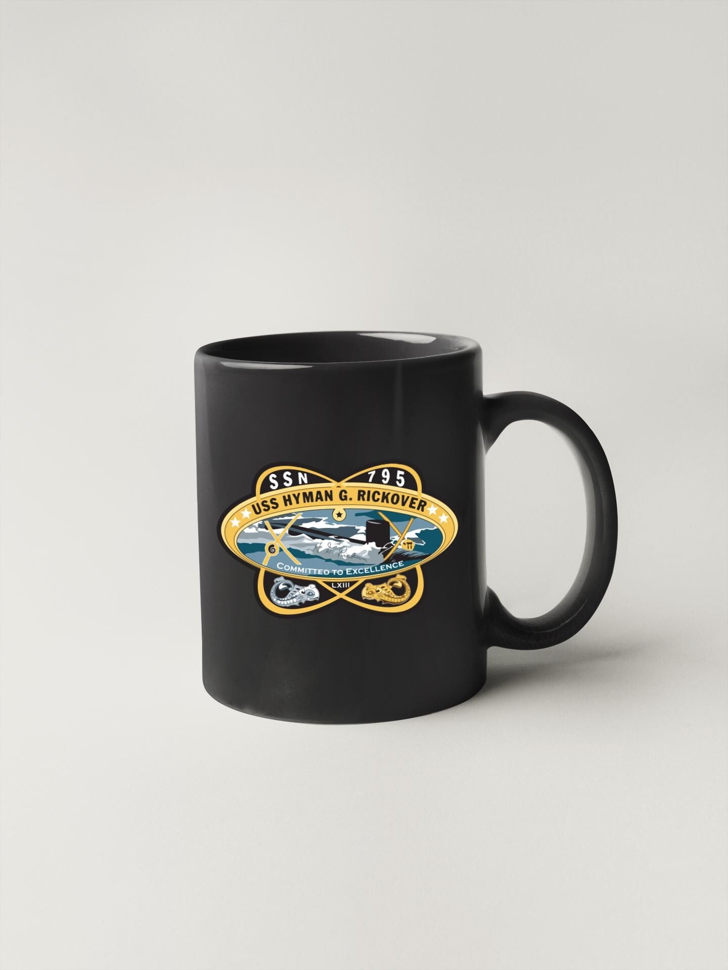 a black coffee mug with a picture of a truck on it